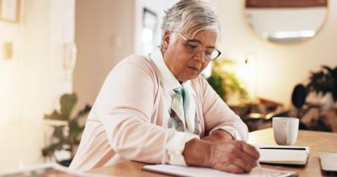 Older woman completing a survey