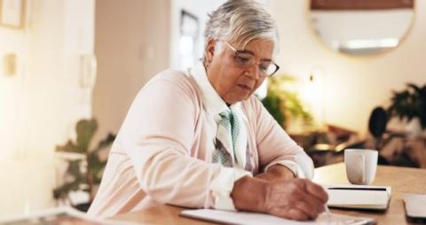 An older woman completing a survey
